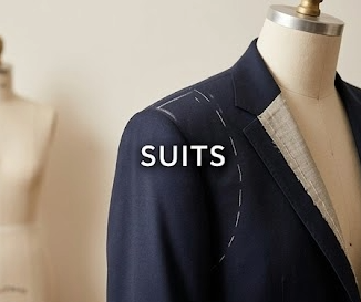 Navy suit jacket pinned for alterations